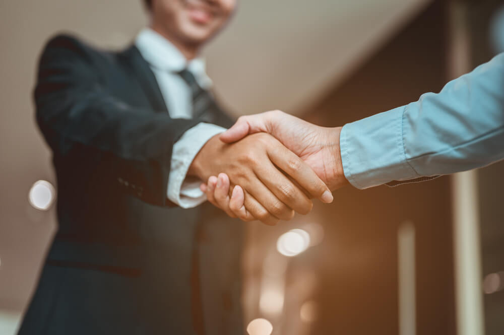Businessman Shake Hands and Get To Know Each Other Before They Start Talking About Business